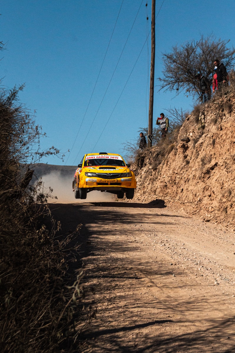 Photo by Lucho Renolfi yellow rally car on road